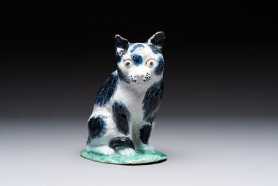 A fine polychrome Brussels faience model of a cat, 18th C.