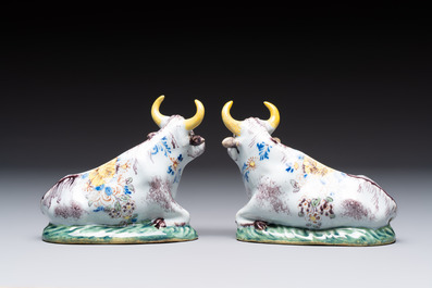A pair of polychrome Dutch Delft reclining cows, 18th C.