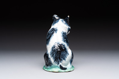 A fine polychrome Brussels faience model of a cat, 18th C.
