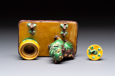 A pair of Chinese sancai-glazed Buddhist lions and an inkwell, 19th C.