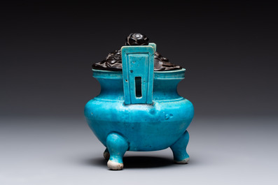 A Chinese turquoise-glazed tripod censer with wooden cover, Ming