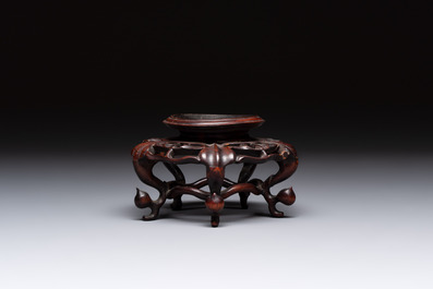 A Chinese verte biscuit 'animals among waves' bowl and a wooden stand, Jiajing mark, Kangxi