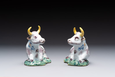 A pair of polychrome Dutch Delft reclining cows, 18th C.