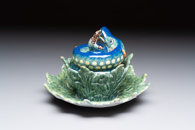 A rare polychrome Dutch Delft pike tureen and cover on stand, 18th C.