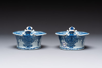 A pair of blue and white Dutch Delft butter tubs and covers, 18th C.