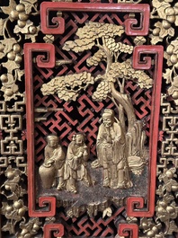A large and fine Chinese gilt-red-lacquered cabinet with figures and antiquities, 19th C.