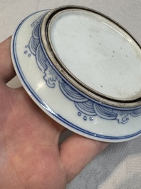A Chinese monochrome 'anhua' 'dragon' bowl and a blue and white 'dragon' saucer, 18/19th C.