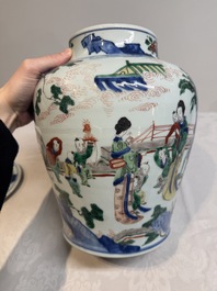 A pair of Chinese wucai vases and covers with court ladies and playing boys, Transitional period