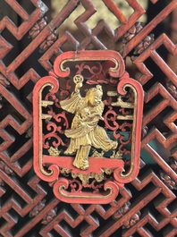 A large and fine Chinese gilt-red-lacquered cabinet with figures and antiquities, 19th C.
