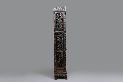 A richly carved Chinese hongmu display cabinet, Canton, 19th C.