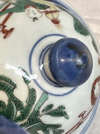 A pair of Chinese wucai vases and covers with court ladies and playing boys, Transitional period