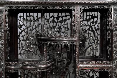 A richly carved Chinese hongmu display cabinet, Canton, 19th C.