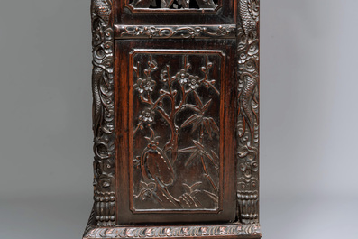 A richly carved Chinese hongmu display cabinet, Canton, 19th C.