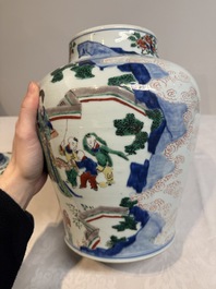 A pair of Chinese wucai vases and covers with court ladies and playing boys, Transitional period