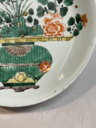 Two Chinese famille verte 'flower basket' dishes and a plate, Kangxi