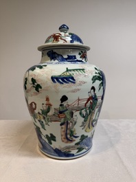 A pair of Chinese wucai vases and covers with court ladies and playing boys, Transitional period