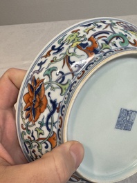 A Chinese doucai 'phoenix and lotus scroll' plate, Qianlong mark and of the period