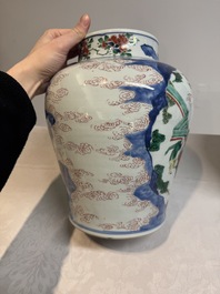 A pair of Chinese wucai vases and covers with court ladies and playing boys, Transitional period