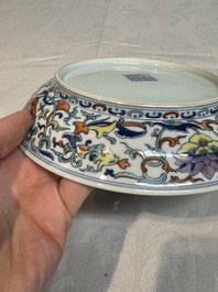 A Chinese doucai 'phoenix and lotus scroll' plate, Qianlong mark and of the period