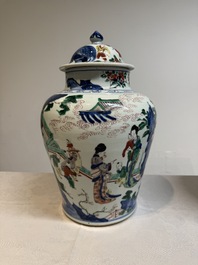 A pair of Chinese wucai vases and covers with court ladies and playing boys, Transitional period