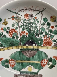 Two Chinese famille verte 'flower basket' dishes and a plate, Kangxi