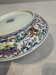A Chinese doucai 'phoenix and lotus scroll' plate, Qianlong mark and of the period