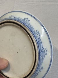A Chinese monochrome 'anhua' 'dragon' bowl and a blue and white 'dragon' saucer, 18/19th C.