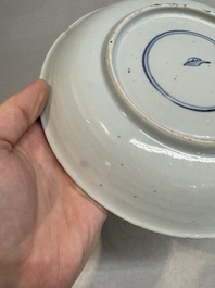 Two Chinese famille verte 'flower basket' dishes and a plate, Kangxi