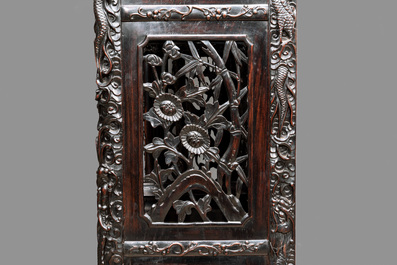 A richly carved Chinese hongmu display cabinet, Canton, 19th C.