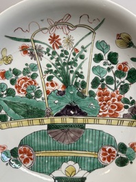 Two Chinese famille verte 'flower basket' dishes and a plate, Kangxi