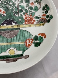 Two Chinese famille verte 'flower basket' dishes and a plate, Kangxi