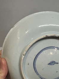 Two Chinese famille verte 'flower basket' dishes and a plate, Kangxi