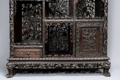 A richly carved Chinese hongmu display cabinet, Canton, 19th C.