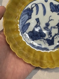 A rare Chinese blue and white yellow-glazed border chrysanthemum-shaped plate with figural design, hare mark, Jiajing