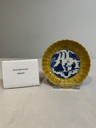 A rare Chinese blue and white yellow-glazed border chrysanthemum-shaped plate with figural design, hare mark, Jiajing