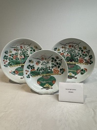Two Chinese famille verte 'flower basket' dishes and a plate, Kangxi