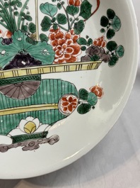 Two Chinese famille verte 'flower basket' dishes and a plate, Kangxi