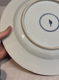 A Chinese famille verte dish with two ladies and a boy holding a lotus, artemisia leaf mark, Kangxi