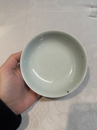 A Chinese monochrome 'anhua' 'dragon' bowl and a blue and white 'dragon' saucer, 18/19th C.