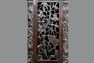 A richly carved Chinese hongmu display cabinet, Canton, 19th C.