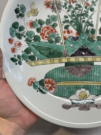 Two Chinese famille verte 'flower basket' dishes and a plate, Kangxi