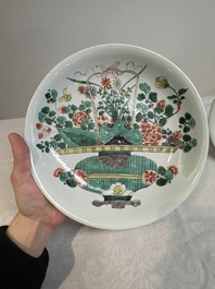 Two Chinese famille verte 'flower basket' dishes and a plate, Kangxi