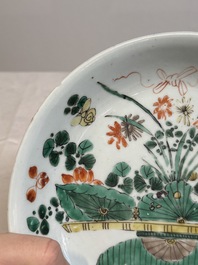 Two Chinese famille verte 'flower basket' dishes and a plate, Kangxi