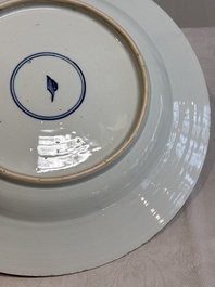 A Chinese famille verte dish with two ladies and a boy holding a lotus, artemisia leaf mark, Kangxi