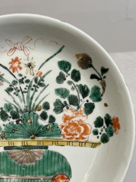 Two Chinese famille verte 'flower basket' dishes and a plate, Kangxi