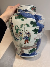 A pair of Chinese wucai vases and covers with court ladies and playing boys, Transitional period