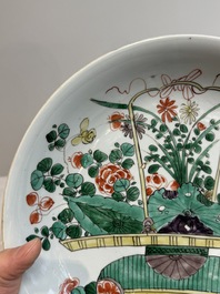 Two Chinese famille verte 'flower basket' dishes and a plate, Kangxi