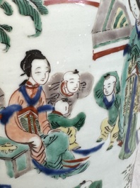 A pair of Chinese wucai vases and covers with court ladies and playing boys, Transitional period