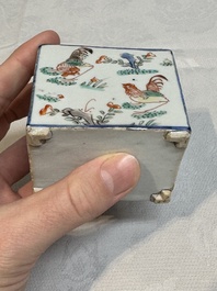A pair of Chinese famille verte rectangular tea caddies and covers with fighting roosters, Kangxi
