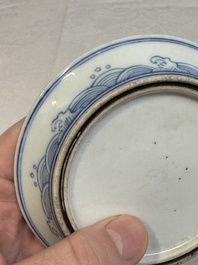A Chinese monochrome 'anhua' 'dragon' bowl and a blue and white 'dragon' saucer, 18/19th C.